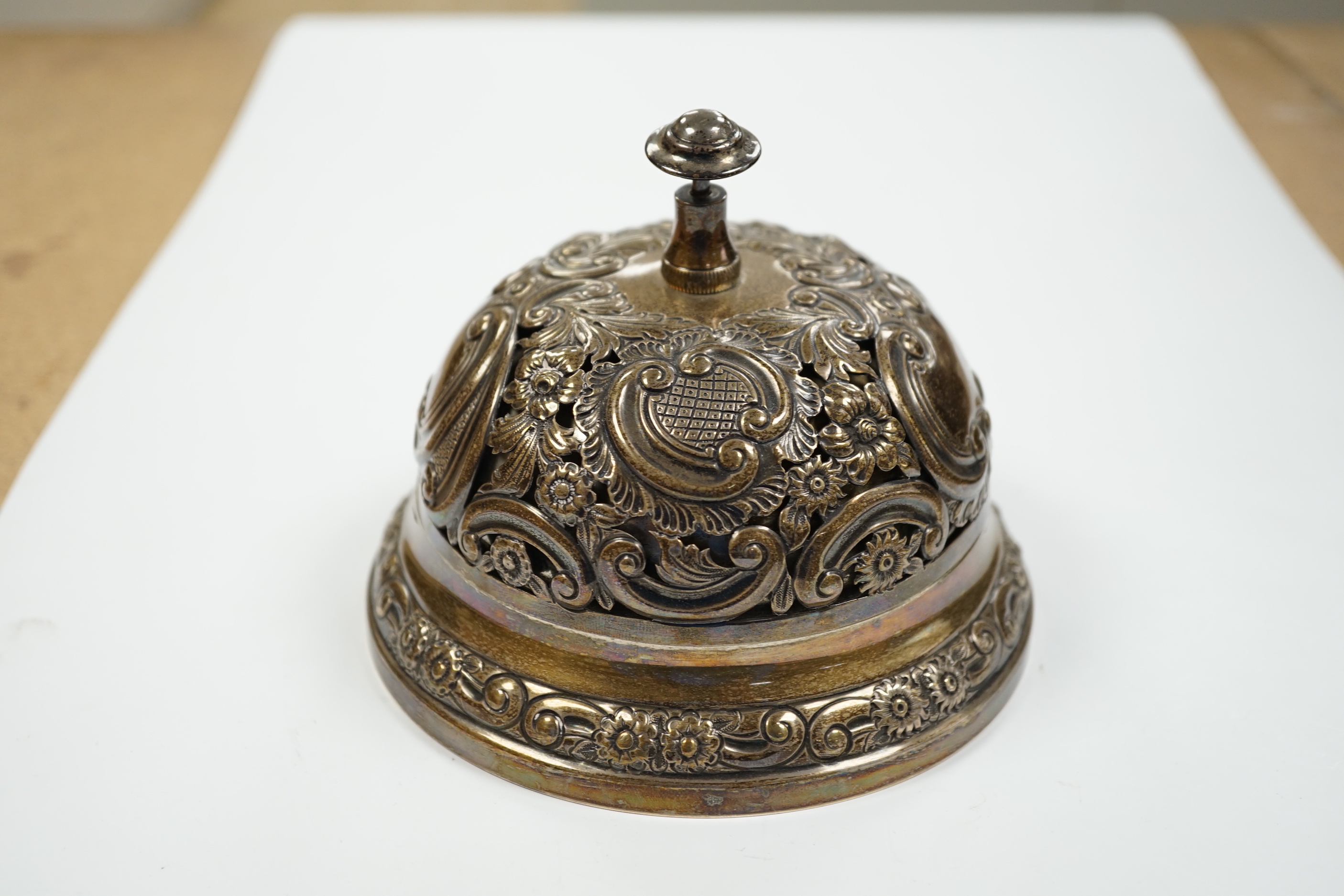 A late Victorian pierced silver mounted table bell, Samuel Walton Smith, Birmingham, 1894, base diameter 13.2cm.